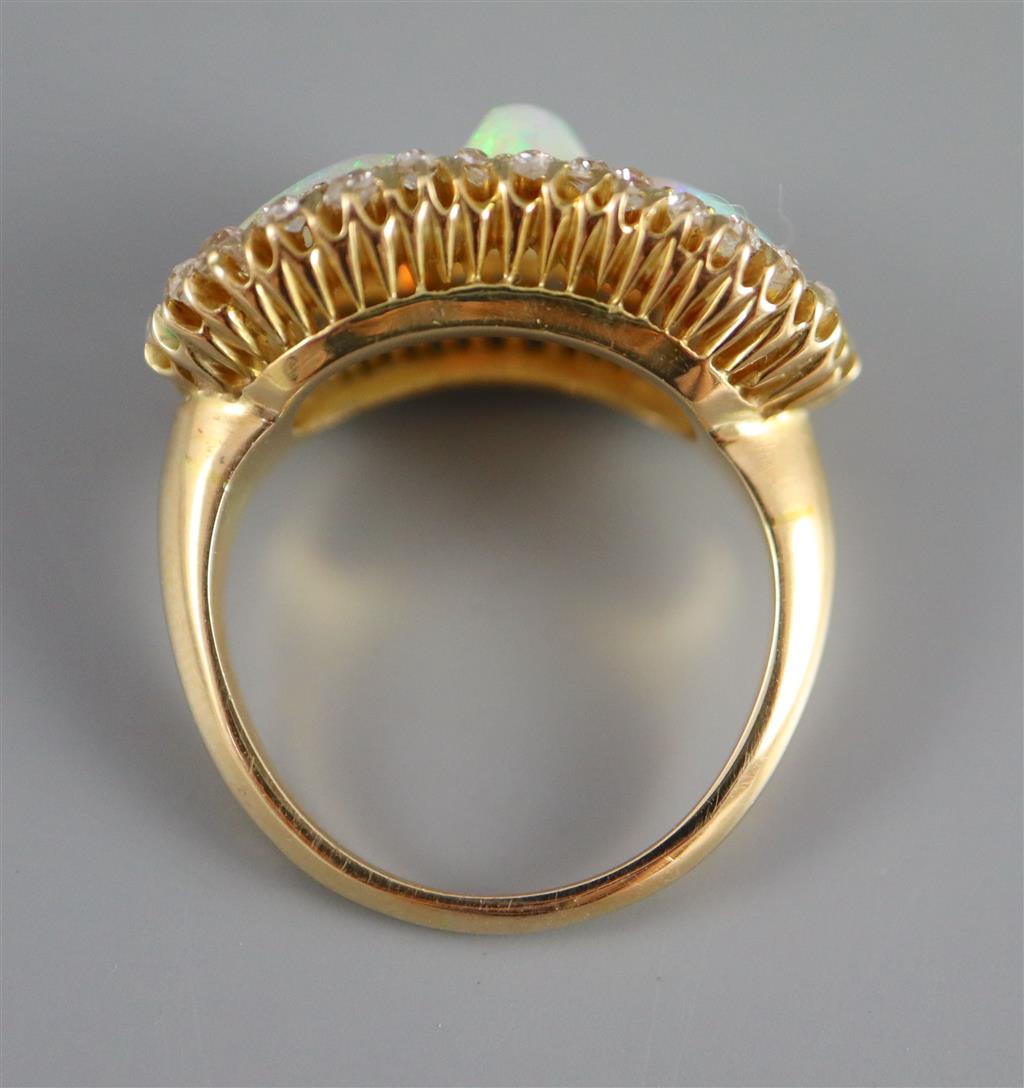 A gold, three stone white opal and diamond set cluster ring,